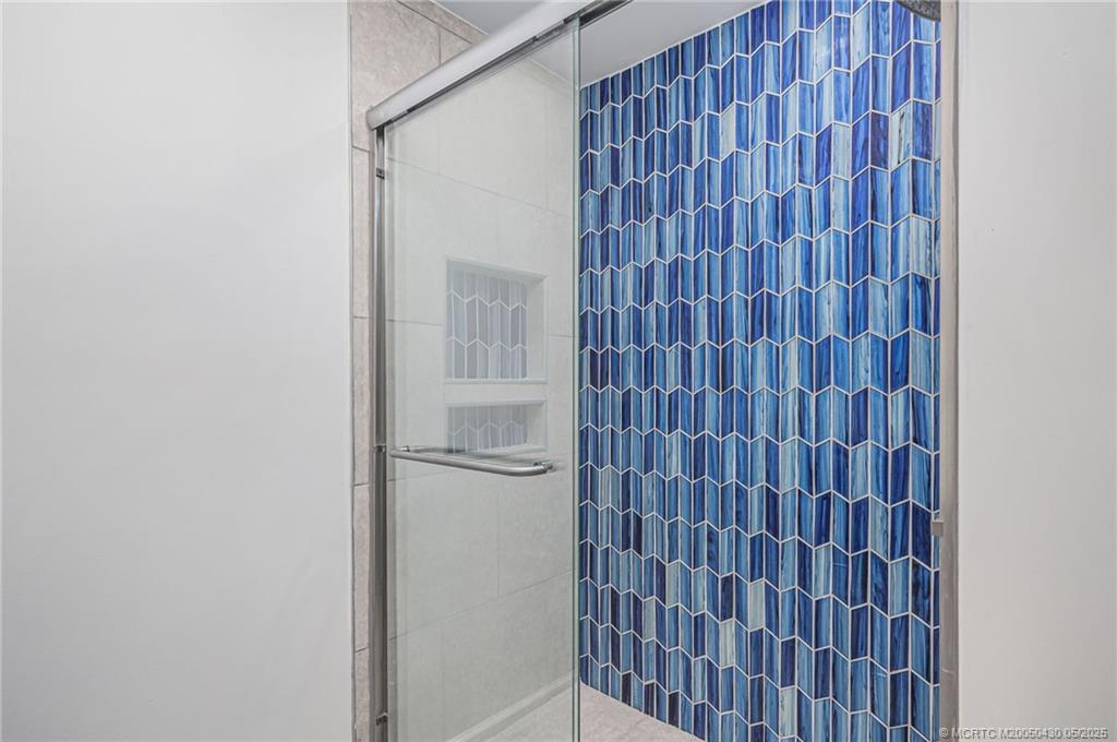 7007 South Indian River Drive Fort Pierce, FL 34982 - Photo 11 of 23 a bathroom with a shower