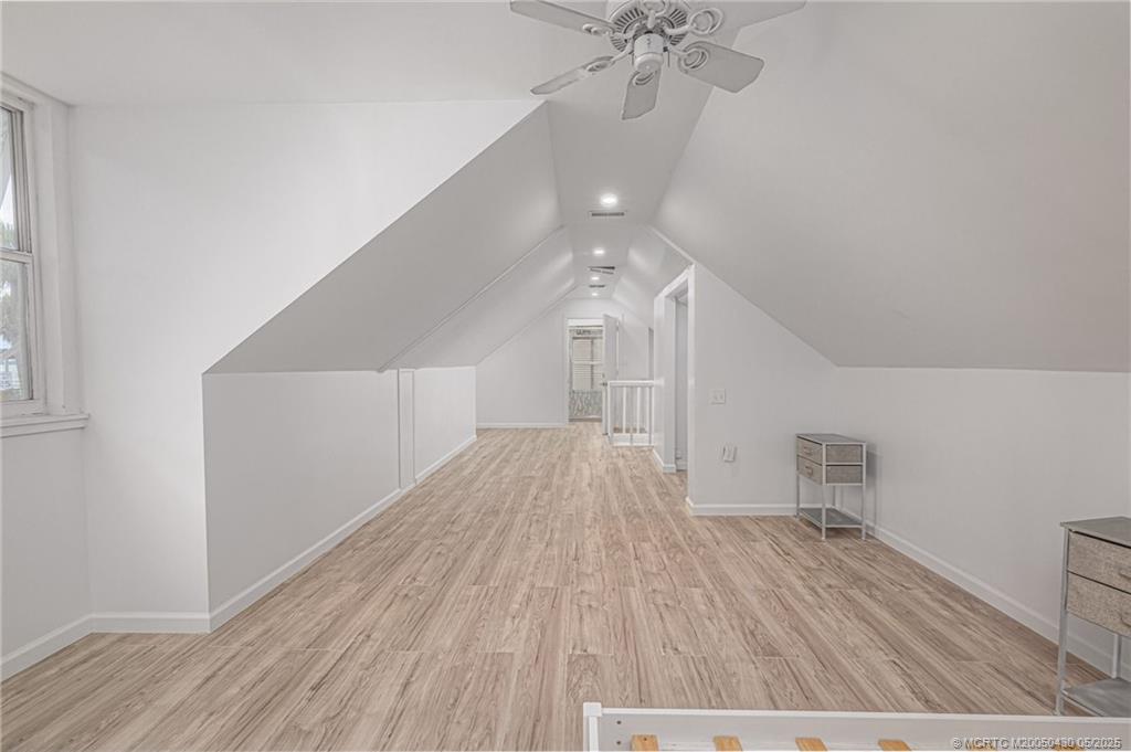 7007 South Indian River Drive Fort Pierce, FL 34982 - Photo 18 of 23 a view of empty room with wooden floor