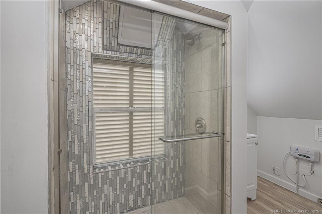 7007 South Indian River Drive Fort Pierce, FL 34982 - Photo 19 of 23 a bathroom with a shower