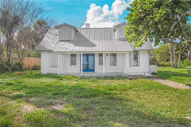 a view of a room with a big yard