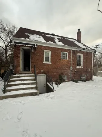 a front view of a house with a wooden fence