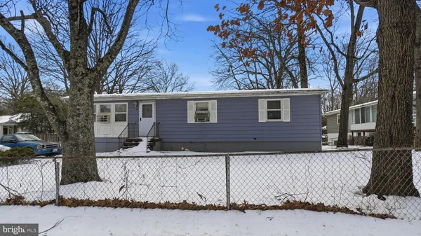a view of a house with a snow in the yard