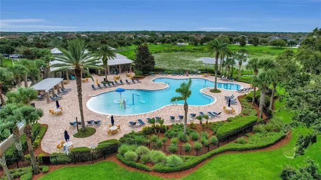 a view of a swimming pool with a lounge chair