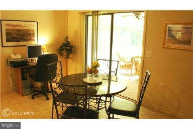 112 Gloucester Road Queenstown, MD 21658 - Photo 5 of 24 a view of a dining room with furniture and a window