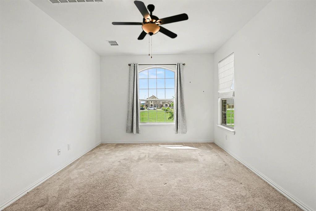 10004 Thornapple Road Fort Worth, TX 76179 - Photo 20 of 39 an empty room with windows and fan
