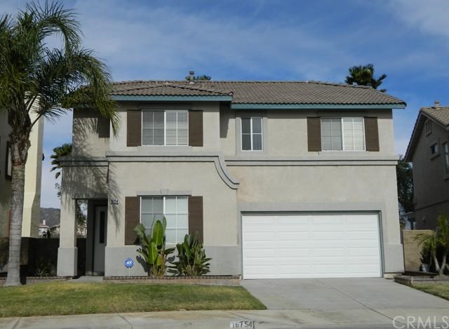 16754 Inverrary Way Fontana, CA 92336 - Photo 1 of 1 a view of a house with a yard and plants