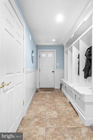 a view of a livingroom with wooden floor and a flat screen tv