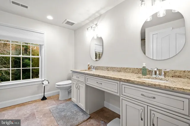 a bedroom with a bed dresser and a window