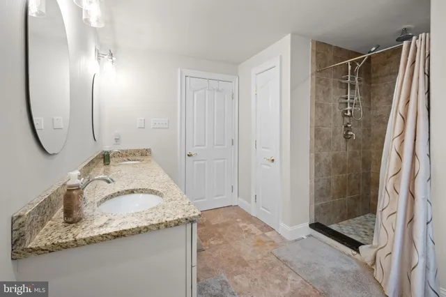 a bedroom with a bed and dresser