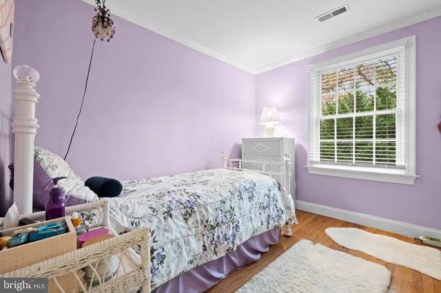 a view of a room with window and lounge chair