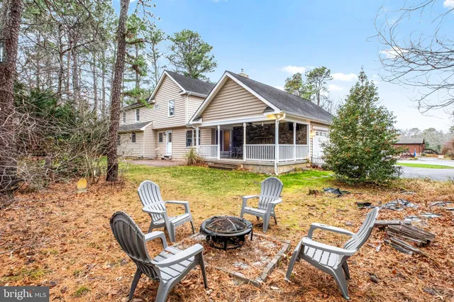 an aerial view of house with yard