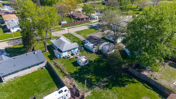 an aerial view of a house with a garden