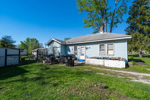 a view of a house with a yard porch and sitting area