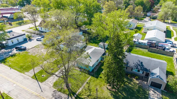 an aerial view of a house with a garden