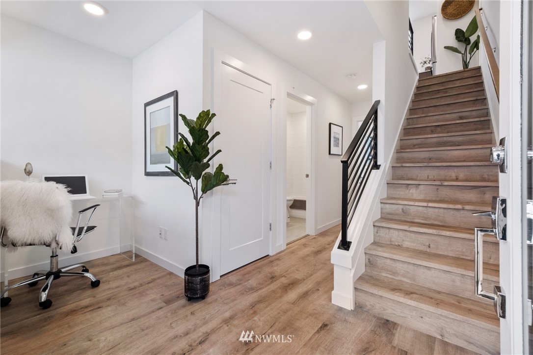 1324 East Spring Street Seattle, WA 98122 - Photo 2 of 29 a view of entryway with wooden floor and stairs