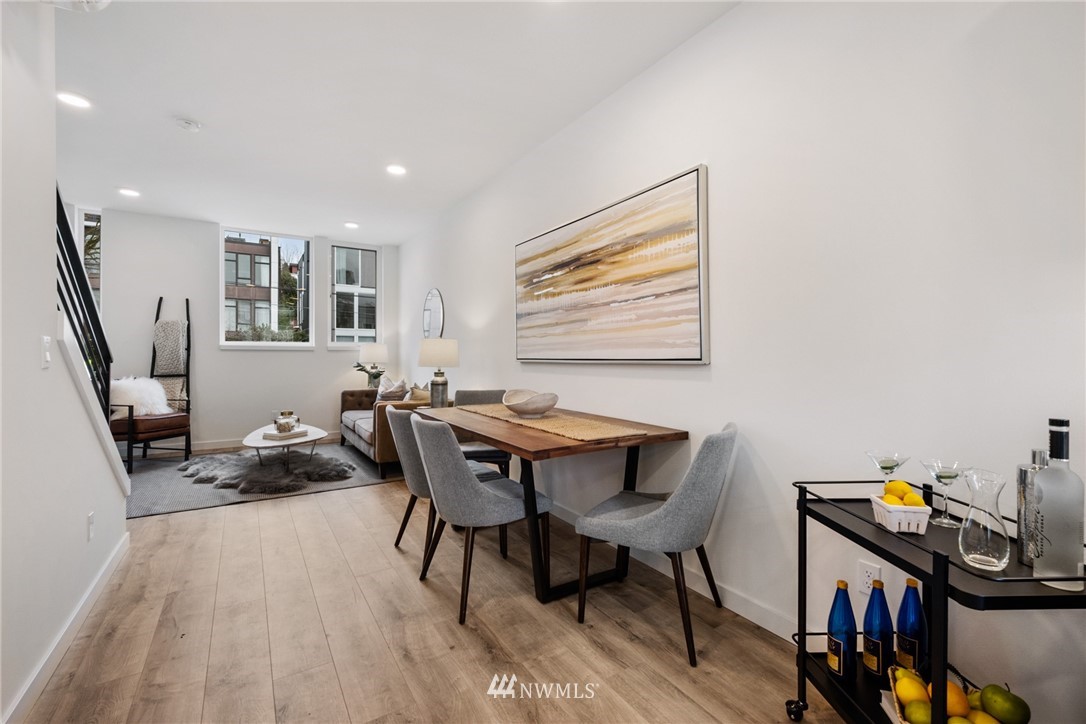 1324 East Spring Street Seattle, WA 98122 - Photo 17 of 29 a view of a workspace with furniture and wooden floor