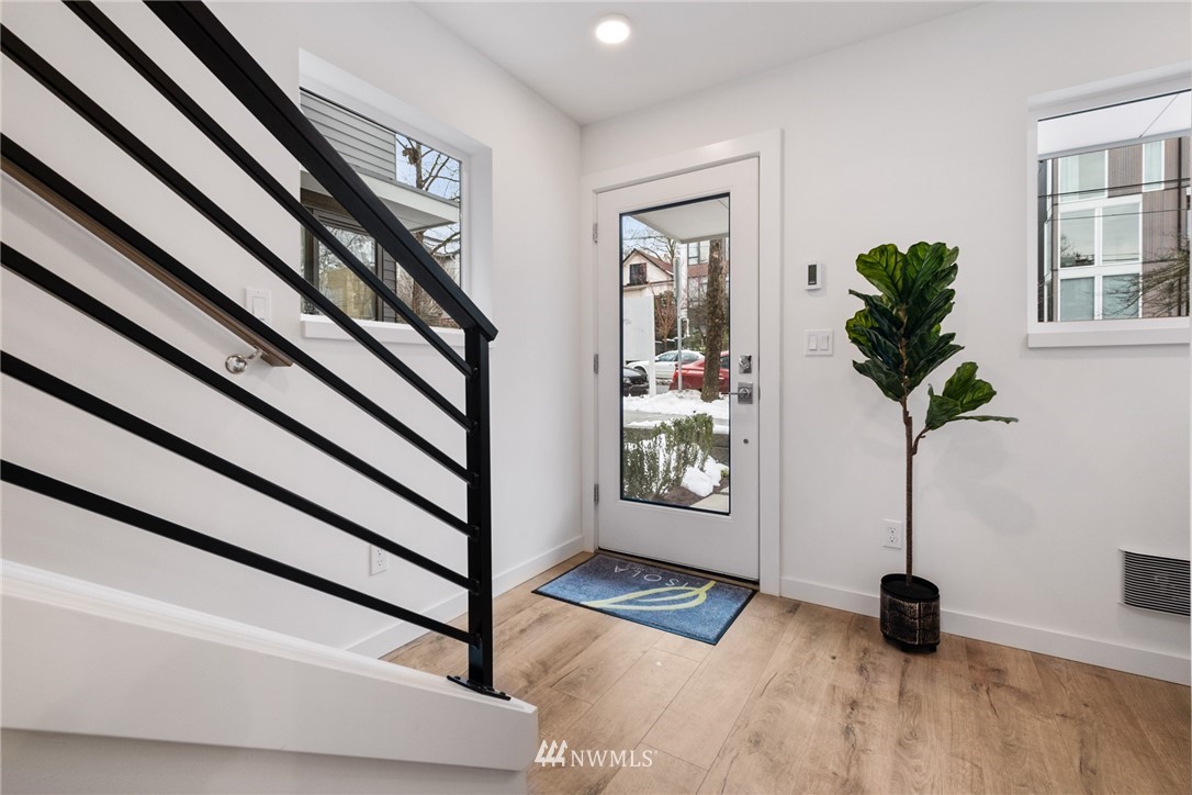 1324 East Spring Street Seattle, WA 98122 - Photo 3 of 29 a view of an entryway with wooden floor