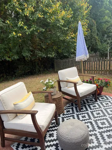 a view of a patio with couple of chairs
