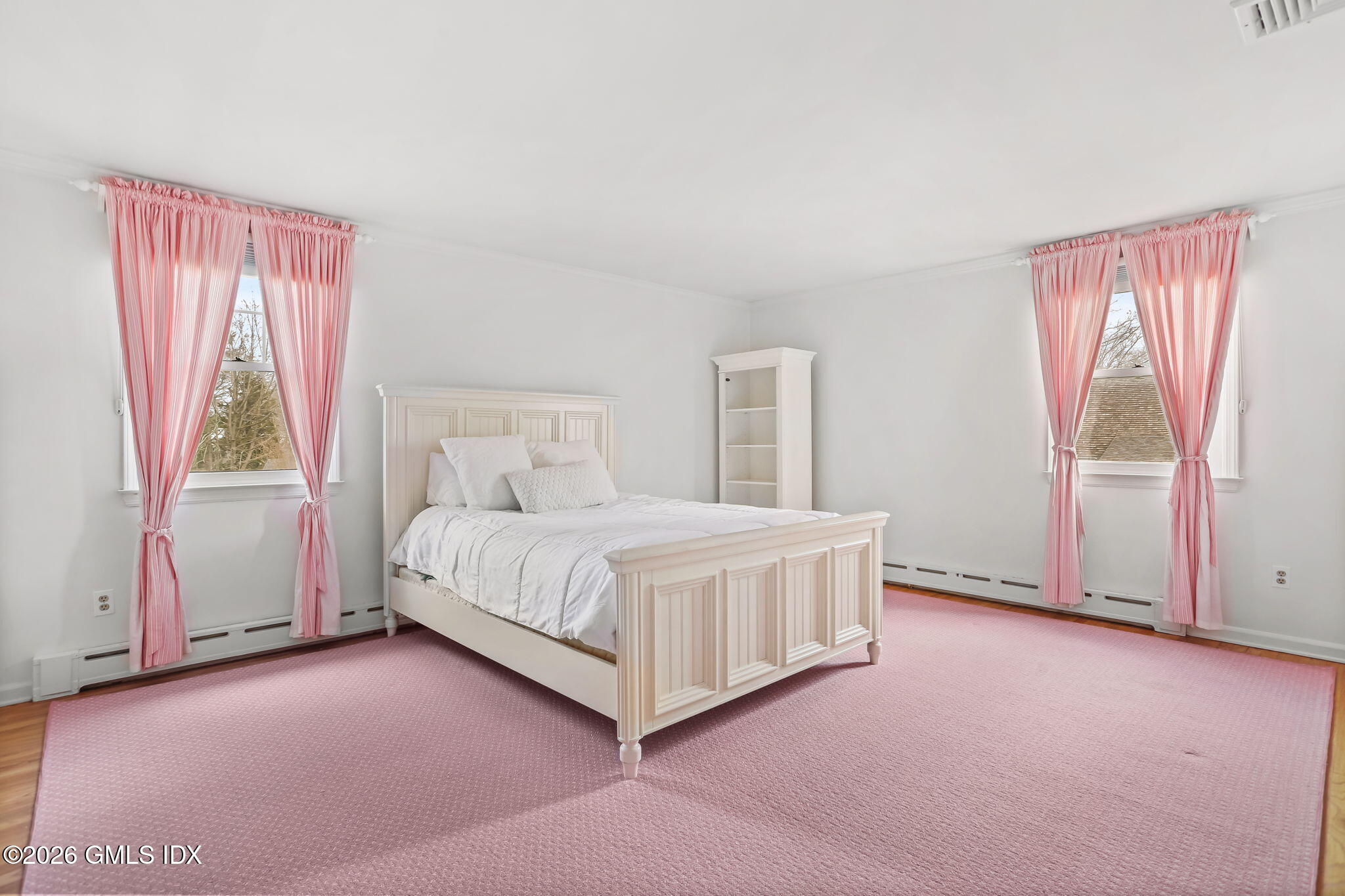 153 Lockwood Road Riverside, CT 06878 - Photo 35 of 58 a bed room with a bed and a chair
