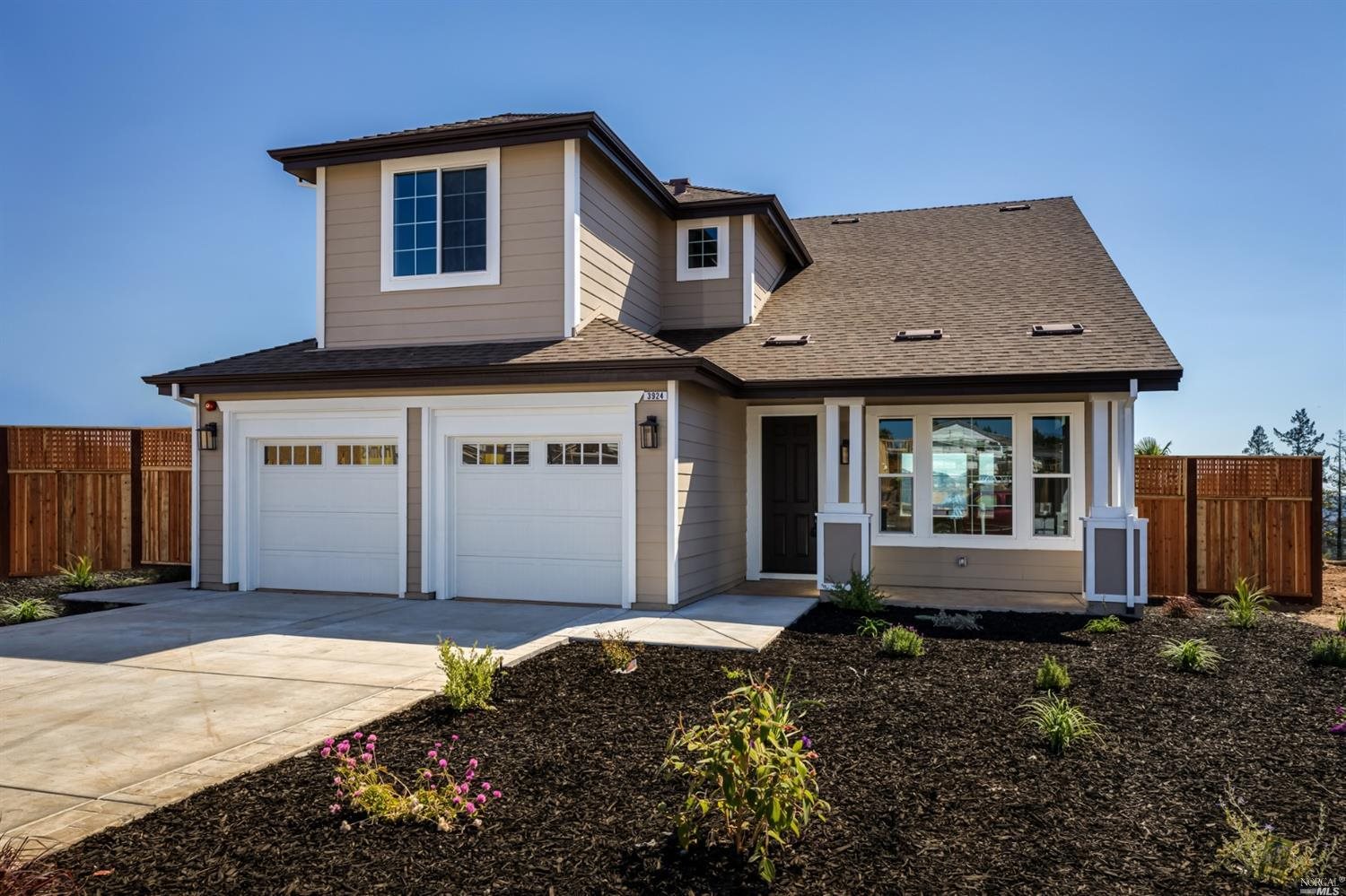 3924 Millbrook Drive Santa Rosa, CA 95404 - Photo 1 of 1 a front view of a house with a garden