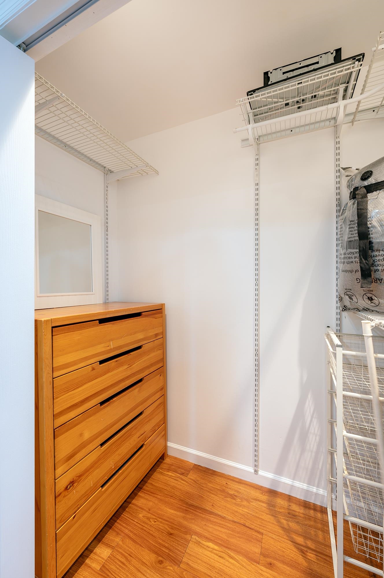 72 Henry Street, Unit 3AGARDEN Jersey City, NJ 07306 - Photo 5 of 13 a view of walk in closet with empty racks