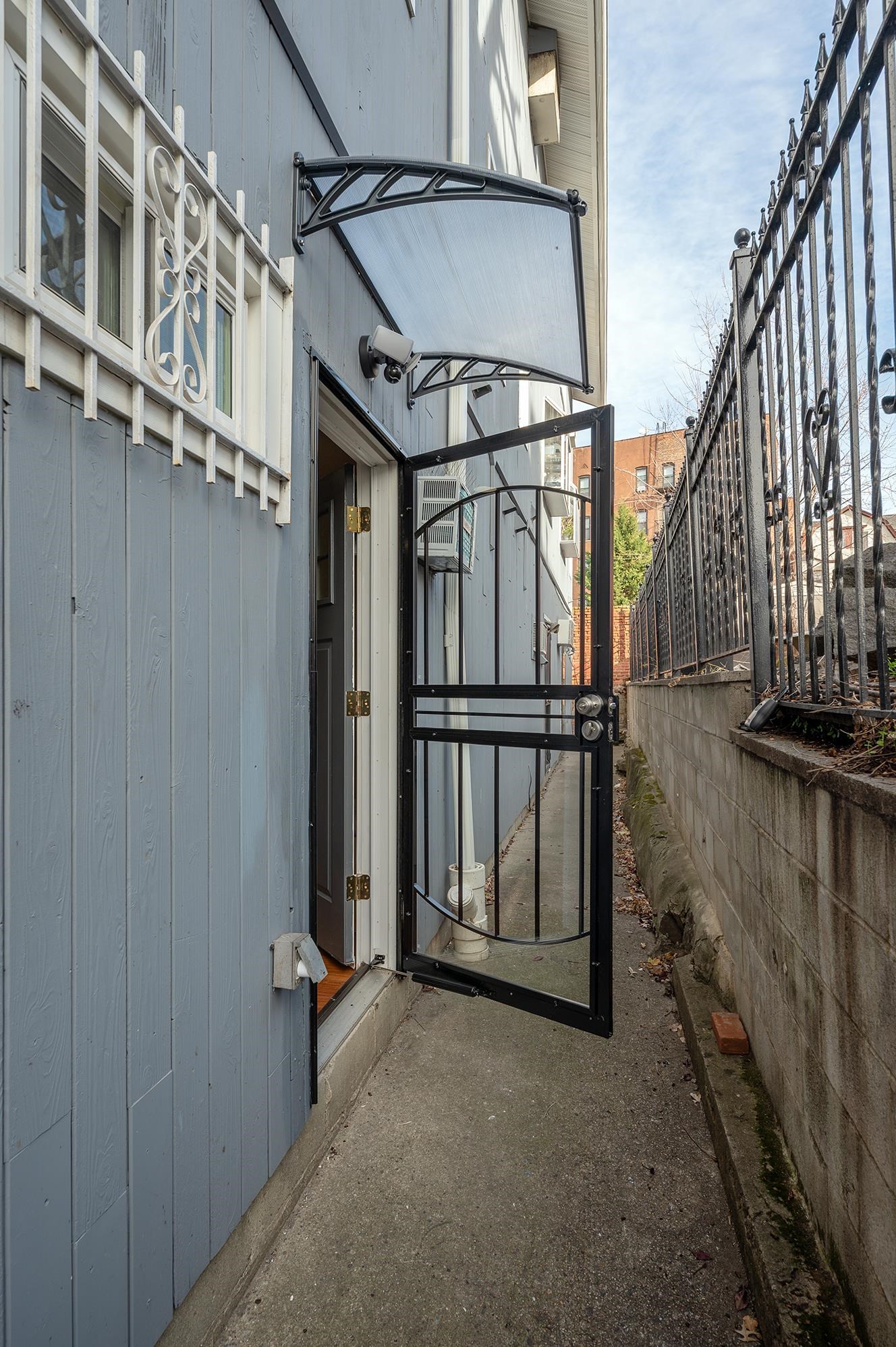 72 Henry Street, Unit 3AGARDEN Jersey City, NJ 07306 - Photo 10 of 13 a view of balcony with wooden floor and fence