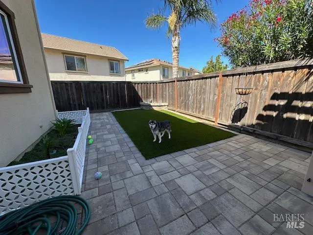 a view of a backyard with a swing