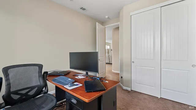 a view of a workspace with furniture