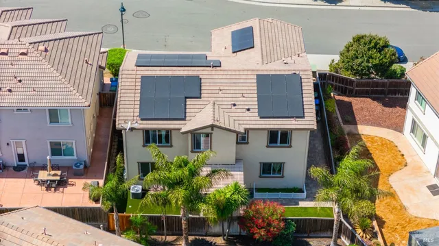 front view of a house with potted plants