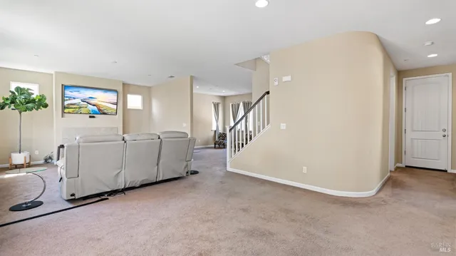 a view of a kitchen with furniture and staircase