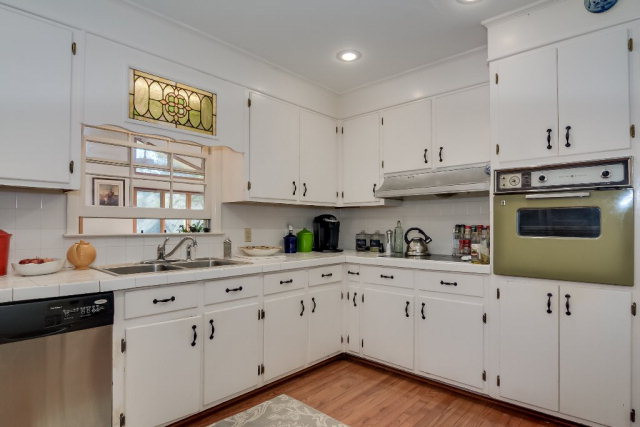 13 Burgundy Road Aiken, SC 29801 - Photo 8 of 23 a kitchen with granite countertop a sink cabinets and stainless steel appliances
