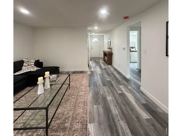 a kitchen with stainless steel appliances granite countertop a refrigerator sink stove microwave and cabinets