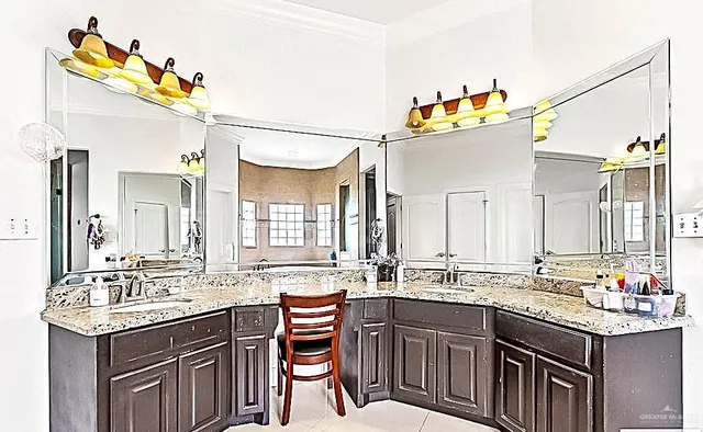 a kitchen that has a sink and cabinets