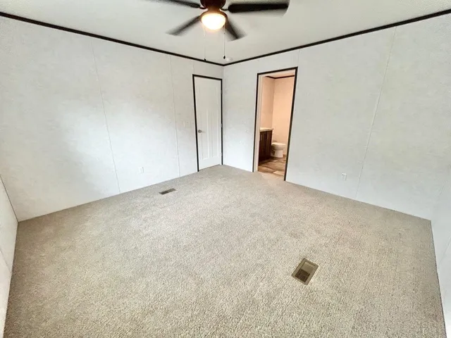 a view of a livingroom with a ceiling fan
