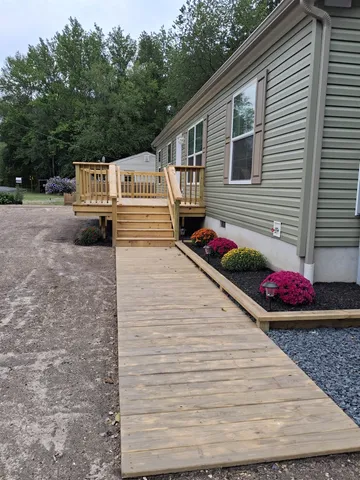 a view of yard with swimming pool and trees