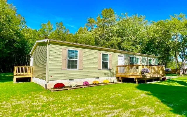 a huge green field with lots of trees