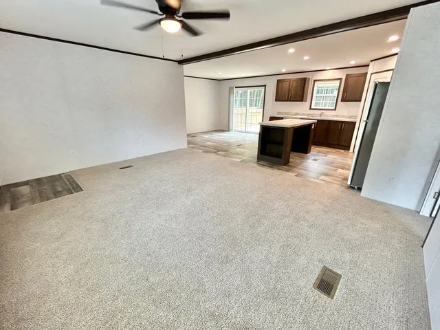 a view of living room with furniture and window