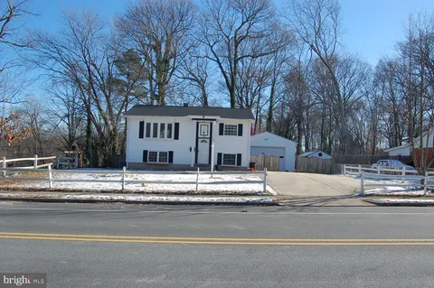 a view of a house with a street
