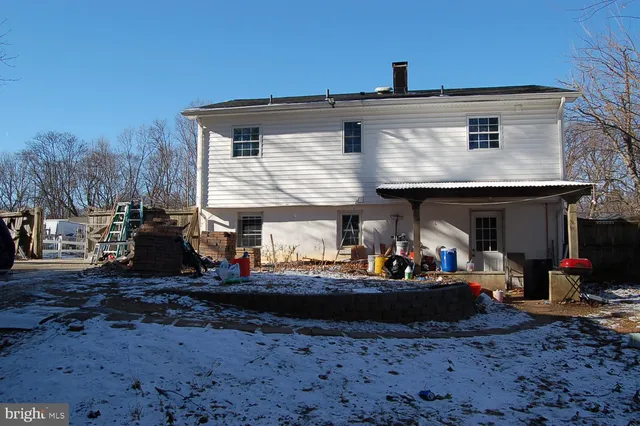 an empty room with wooden floor and a window