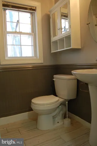 a kitchen with a refrigerator sink and cabinets
