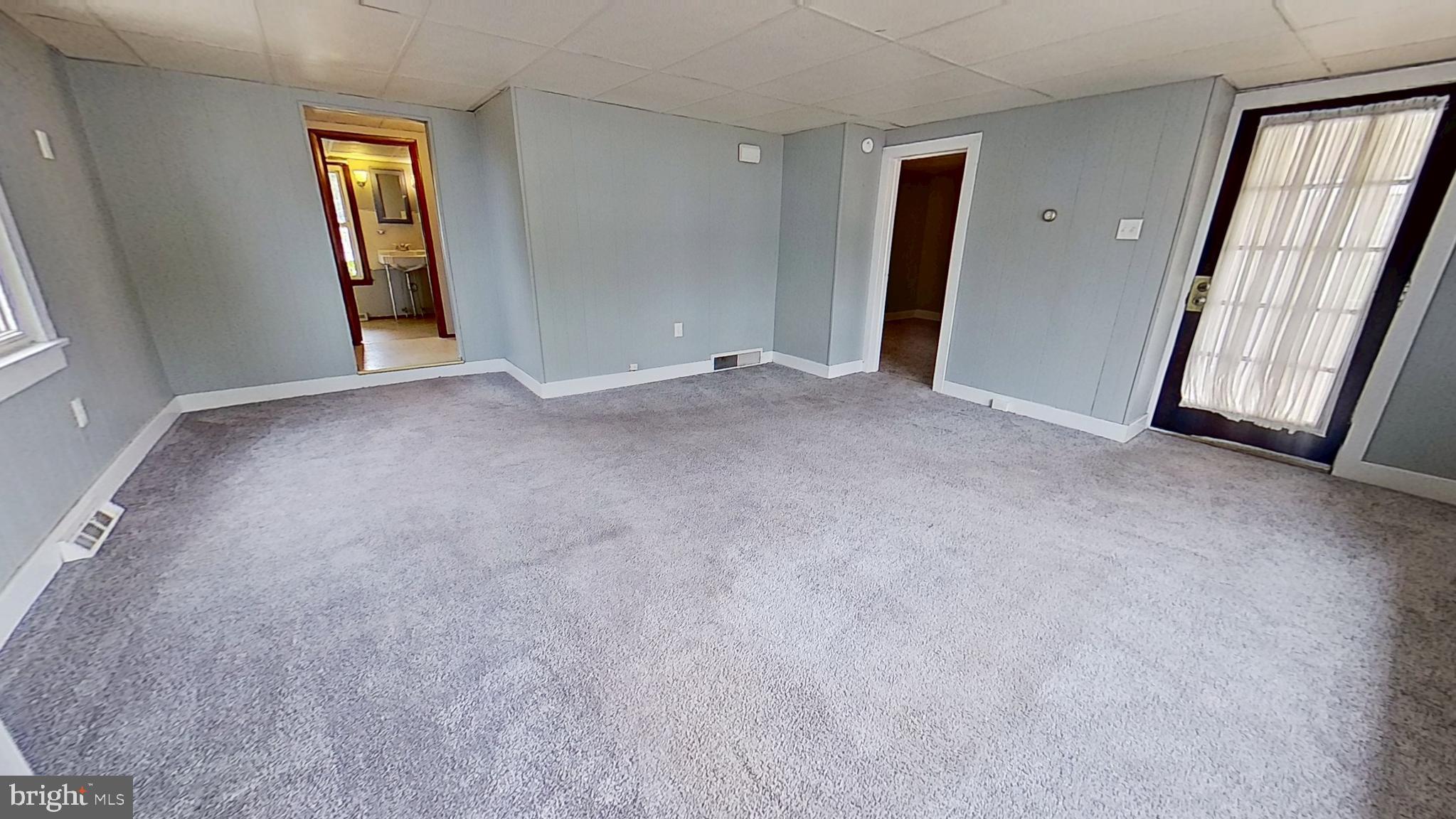 8 Henrietta Street Red Lion, PA 17356 - Photo 5 of 7 an empty room with windows and bathroom