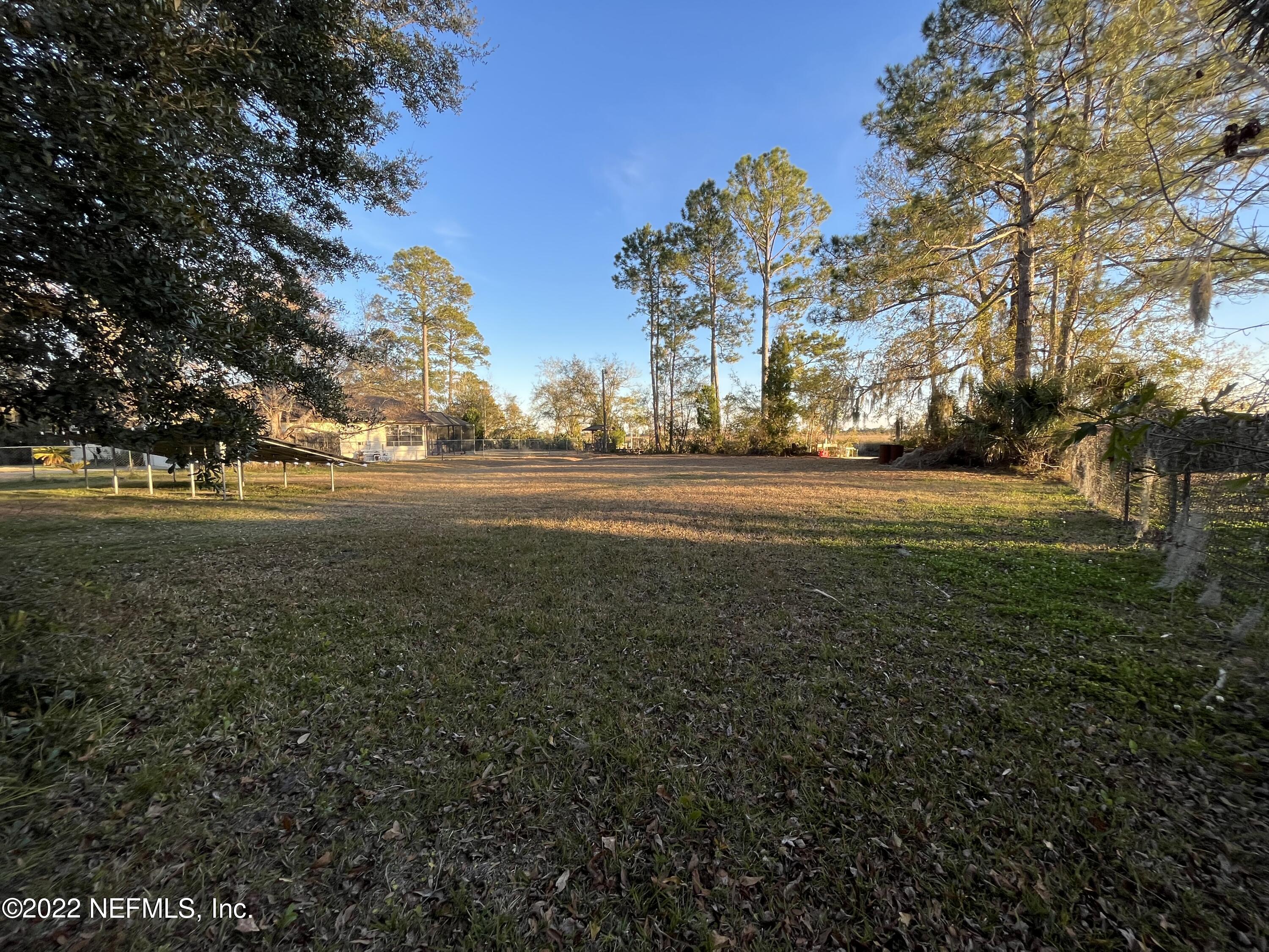 75049 Edwards Road Yulee, FL 32097 - Photo 18 of 23 a view of dirt yard with large trees