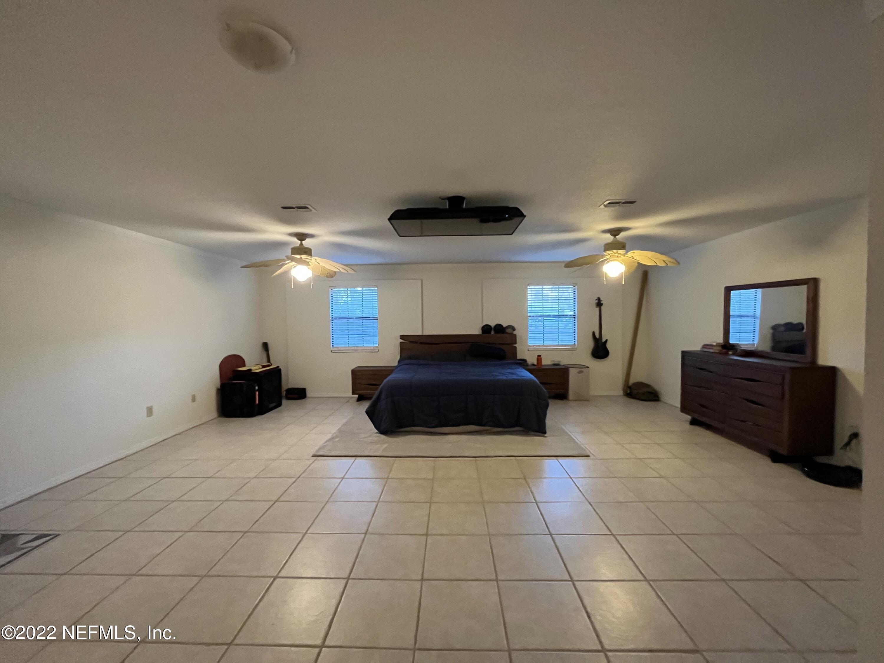 75049 Edwards Road Yulee, FL 32097 - Photo 8 of 23 a living room with furniture and a flat screen tv