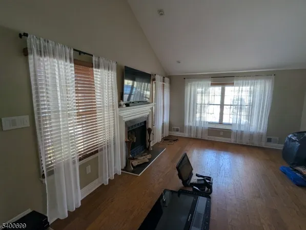 a view of a livingroom with furniture and a fireplace