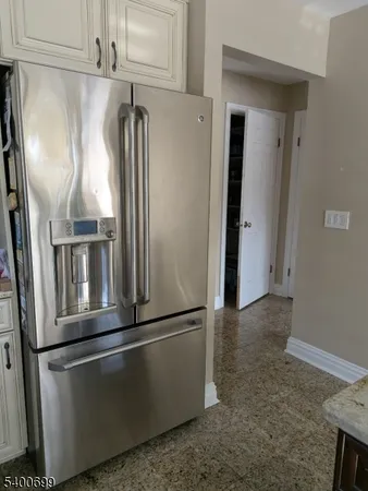 a view of a refrigerator in kitchen