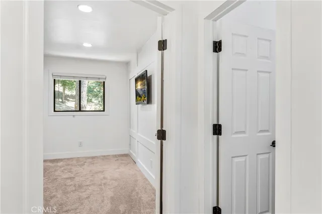 a bedroom with a bed and dresser