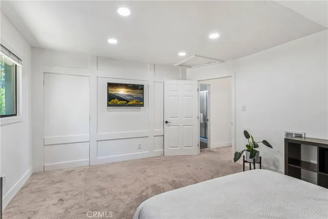 a kitchen with cabinets and window
