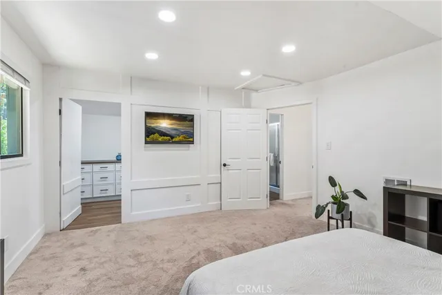 a room with a sink and a mirror