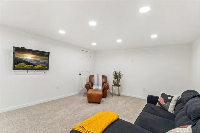 a view of a balcony with wooden floor and outdoor space