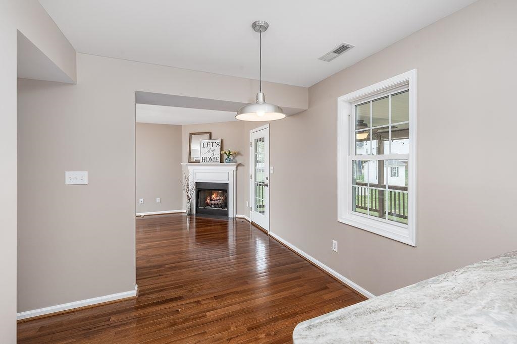 26 Long Bow Road Waynesboro, VA 22980 - Photo 14 of 72 a view of a room with wooden floor fireplace and windows